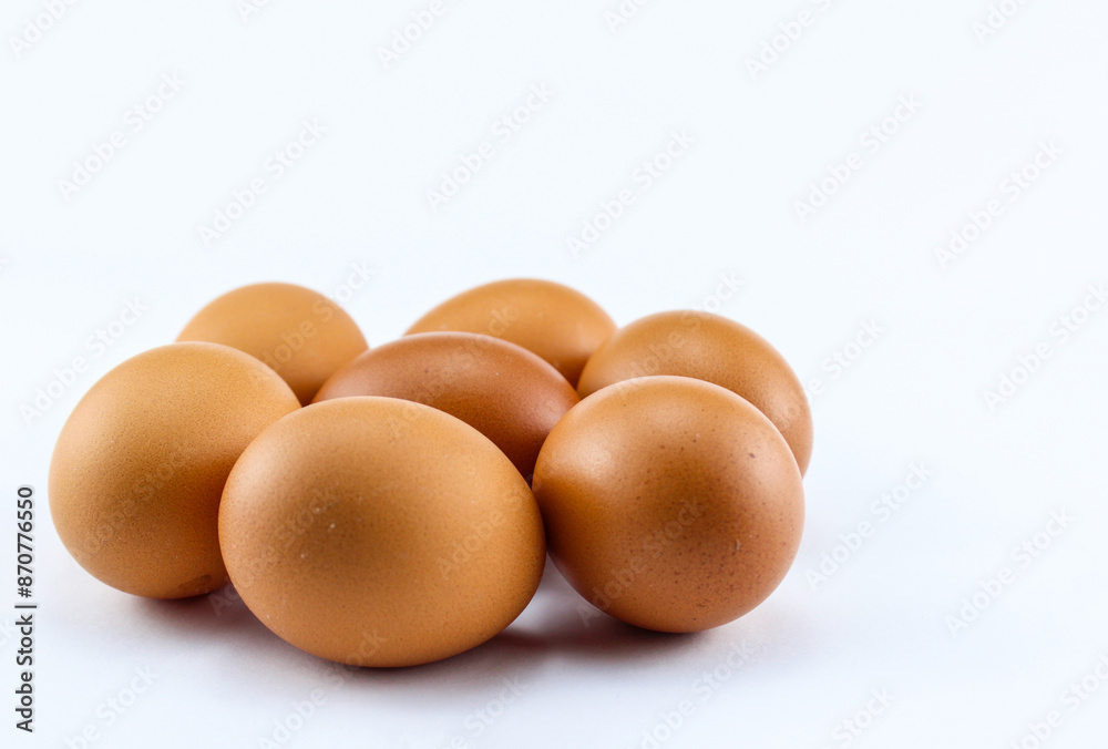 group of seven raw asian chicken eggs on white isolated background group of seven raw asian chicken eggs on white isolated background