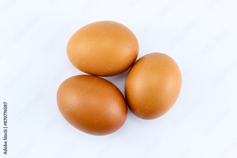 group of three raw asian chicken eggs on white isolated background group of three raw asian chicken eggs on white isolated background