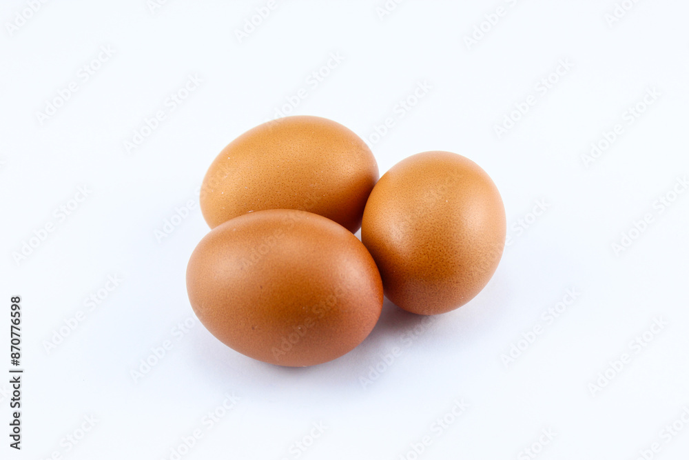 group of three raw asian chicken eggs on white isolated background group of three raw asian chicken eggs on white isolated background