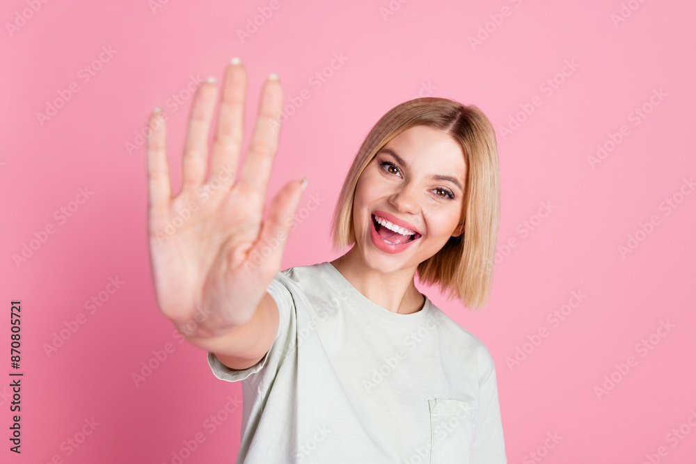 Portrait of cheerful positive friendly girl with bob hairstyle wear white t-shirt give you highfive isolated on pink color background Portrait of cheerful positive friendly girl with bob hairstyle wear white t-shirt give you highfive isolated on pink color background