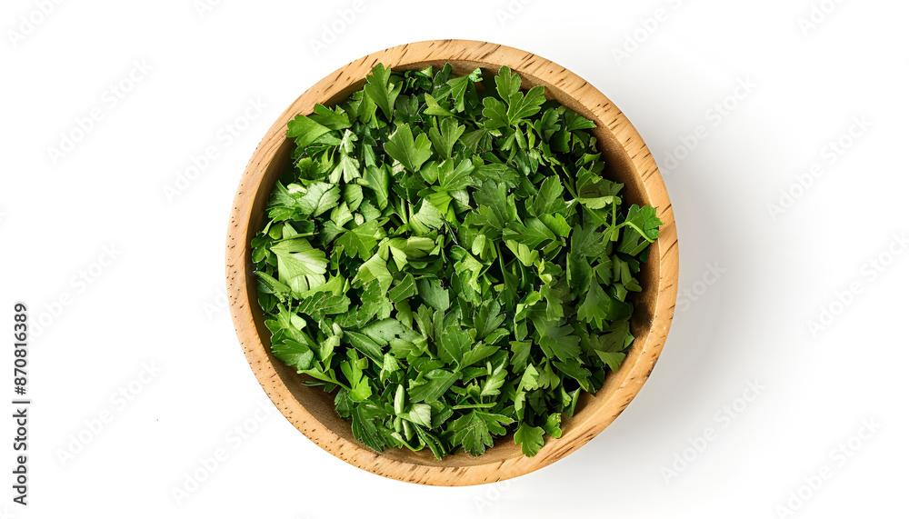 Chopped parsley leaves in wooden bowl isolated on white, top view Chopped parsley leaves in wooden bowl isolated on white, top view
