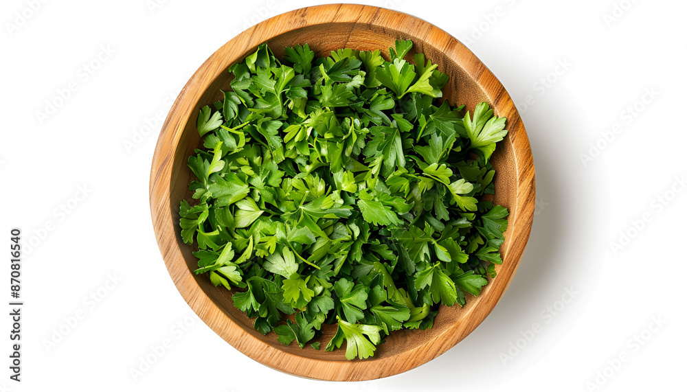 Chopped parsley leaves in wooden bowl isolated on white, top view Chopped parsley leaves in wooden bowl isolated on white, top view