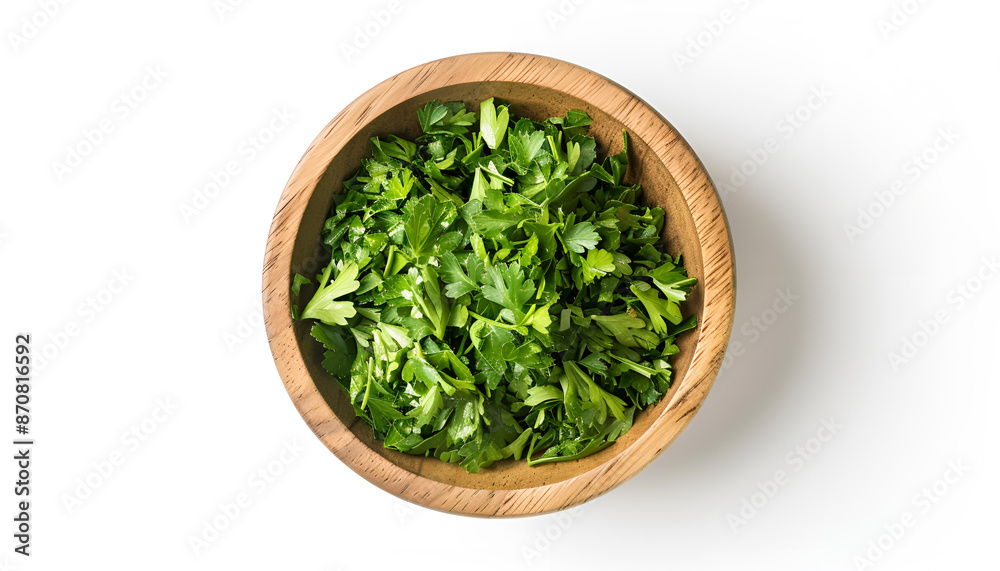 Chopped parsley leaves in wooden bowl isolated on white, top view Chopped parsley leaves in wooden bowl isolated on white, top view