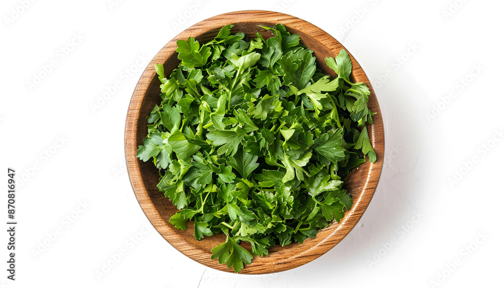 Chopped parsley leaves in wooden bowl isolated on white, top view Chopped parsley leaves in wooden bowl isolated on white, top view