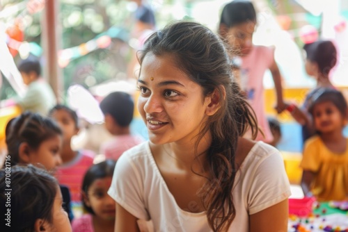 Young Indian Volunteer Engaging with Children at a Cultural Event