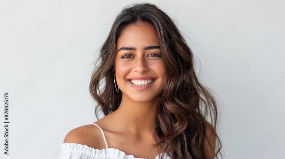 Portrait of a beautiful young latin model woman smiling on a white background Portrait of a beautiful young latin model woman smiling on a white background