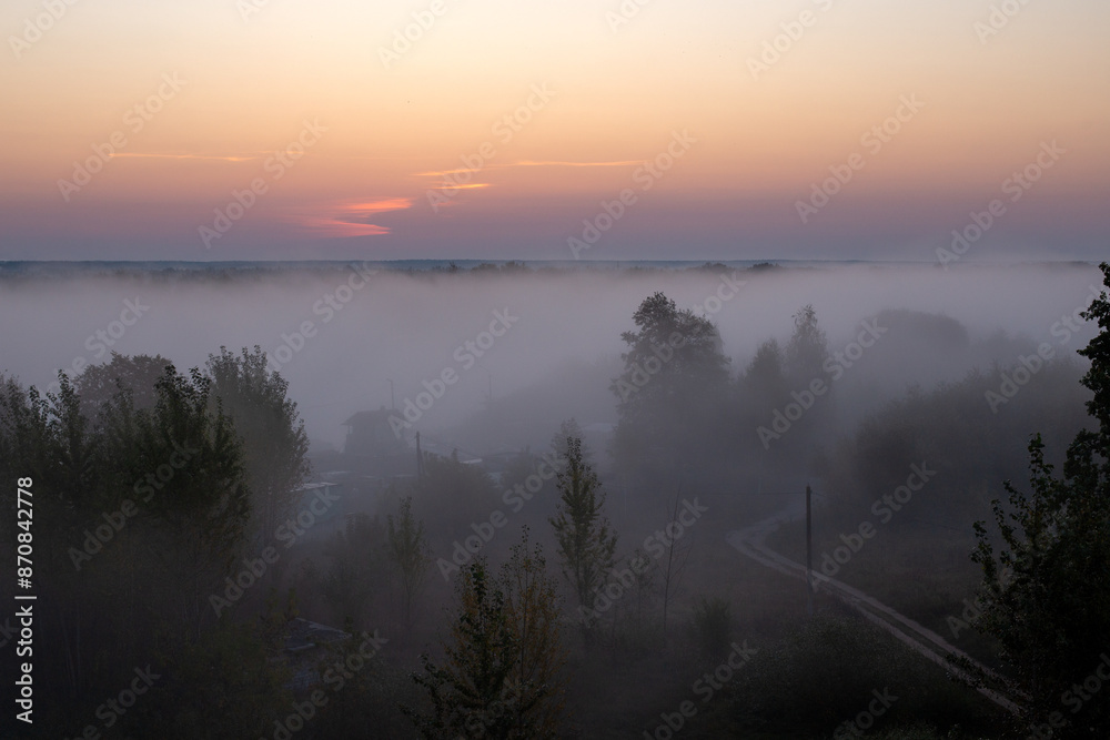 Obraz premium Beautiful foggy morning, mystical and mesmerizing landscape