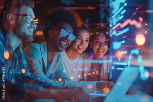 A group of young friends enjoys interacting with a vibrant and colorful digital touchscreen table, filled with laughter and engagement.