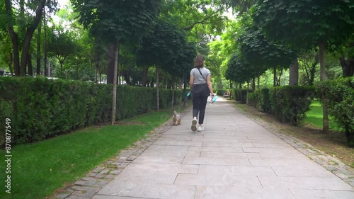 Wallpaper Mural A girl walks her dog in Kikvidze Park in Tbilisi Torontodigital.ca