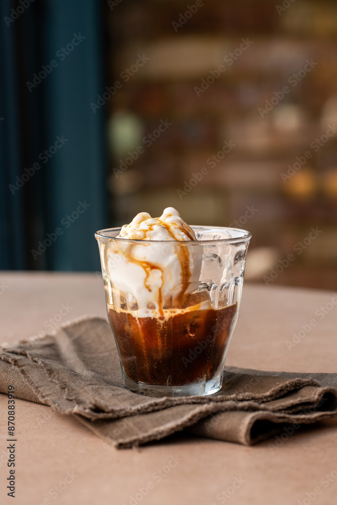 Vanilla ice cream with coffee in a glass. Summer cold drink. Vanilla ice cream with coffee in a glass. Summer cold drink.