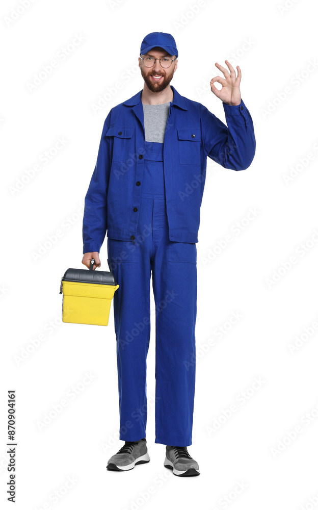 Professional auto mechanic with tool box showing OK gesture on white background Professional auto mechanic with tool box showing OK gesture on white background