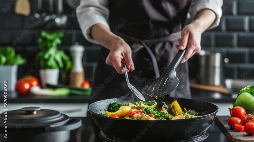 Chef cooking delicious food in a kitchen Chef cooking delicious food in a kitchen