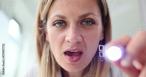 Wallpaper Mural Woman physician checks throat of patient using flashlight Torontodigital.ca