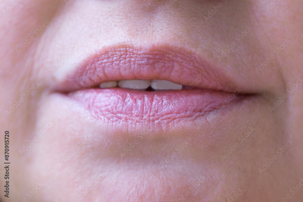 Fototapeta premium close up lips of mature female face, happy 50-year-old woman with gentle smile, Anti-aging Procedures in mature age concept, Women's Health and Self-Esteem