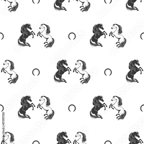 Seamless pattern with black and white horses and horseshoes on a white background