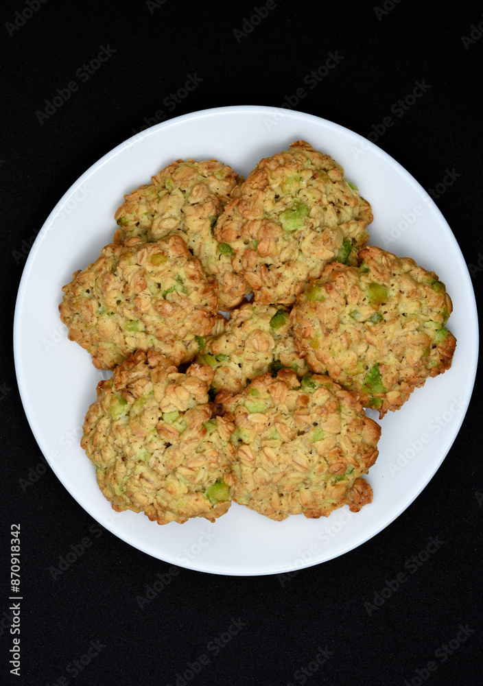 Sweet oatmeal cookies with filling on a white plate. A sweet breakfast. Sweet oatmeal cookies with filling on a white plate. A sweet breakfast.
