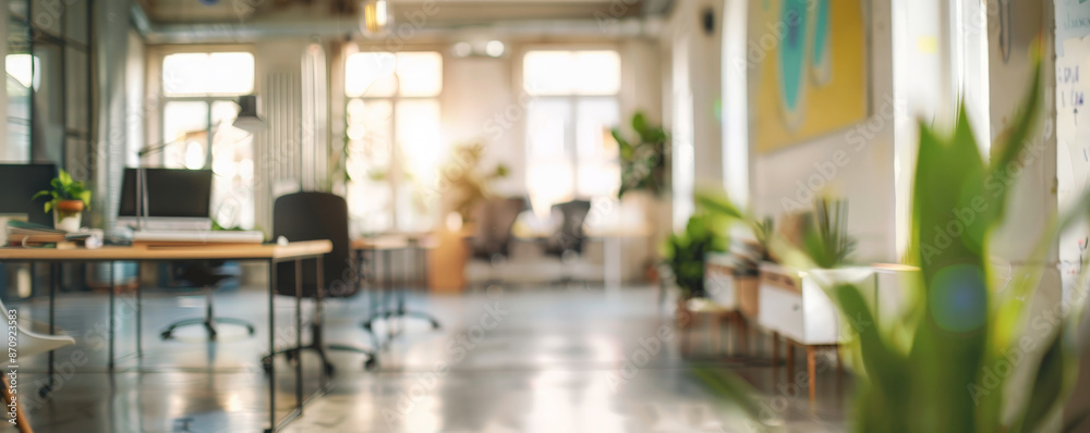 A blurred bright office background with open desks, vibrant artwork, and natural light, creating a dynamic and inspiring workspace. A blurred bright office background with open desks, vibrant artwork, and natural light, creating a dynamic and inspiring workspace.