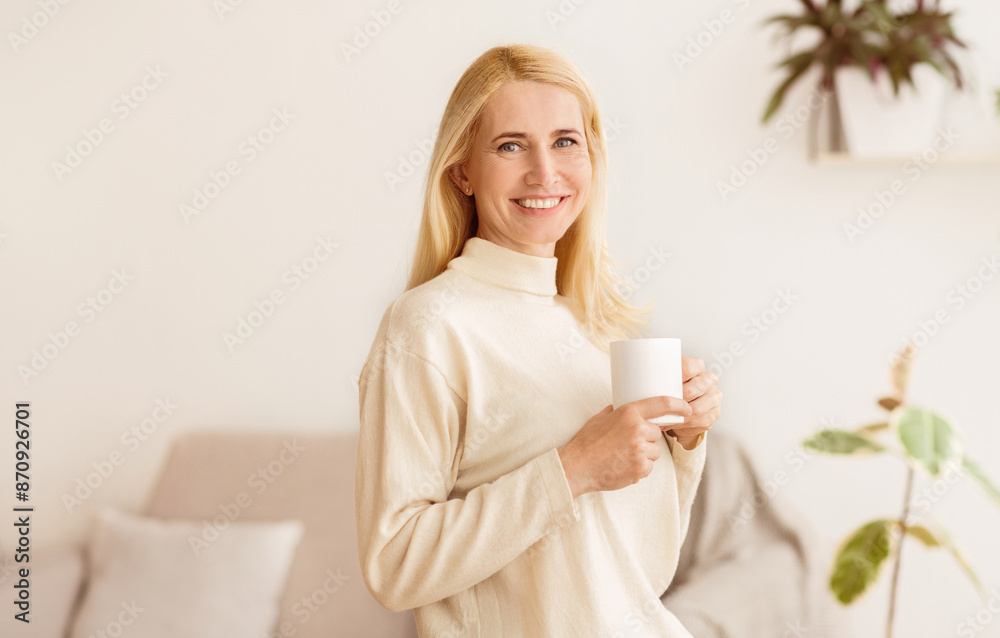 Happy Woman Drinking Morning Coffee, Looking At Camera And Resting At Home, Empty Space Happy Woman Drinking Morning Coffee, Looking At Camera And Resting At Home, Empty Space