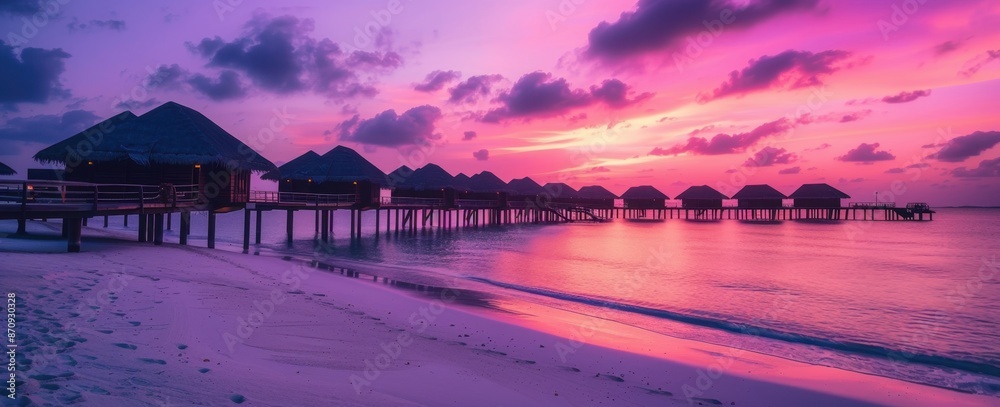 Fototapeta premium A stunning purple and pink sunset over the Maldives, with silhouettes of wooden bridges leading to thatched roof huts Generative AI