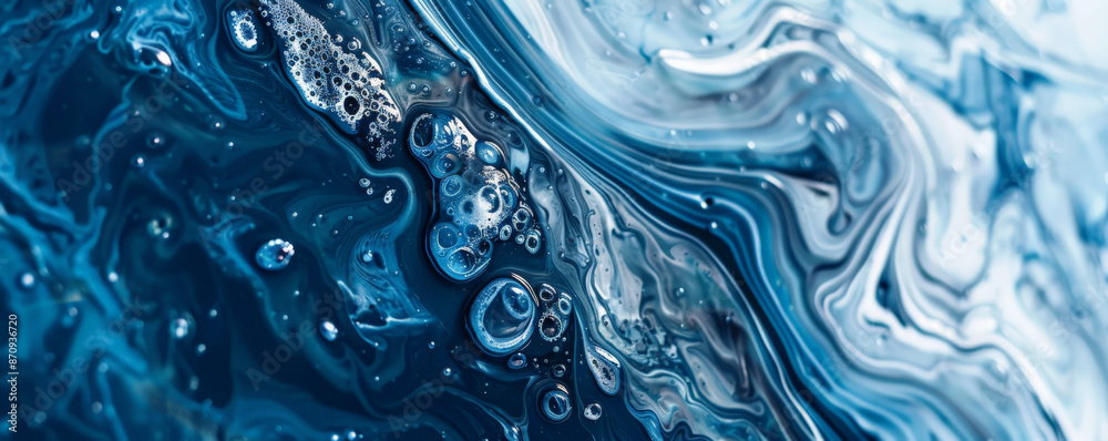 A close-up of liquid acrylic paint in shades of blue and silver, showcasing a smooth, flowing texture. The metallic and cool colors blend beautifully, adding a sense of depth and elegance. A close-up of liquid acrylic paint in shades of blue and silver, showcasing a smooth, flowing texture. The metallic and cool colors blend beautifully, adding a sense of depth and elegance.