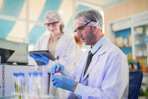 Obraz na plátně scientists and doctors clad in lab coats are rigorously testing chemicals, serums, and antibiotics to develop new treatments for humans and animals