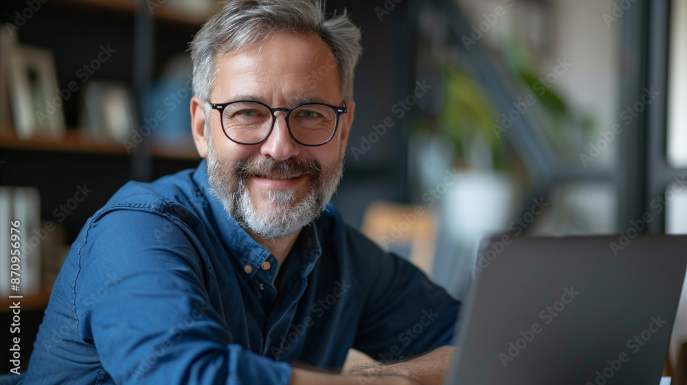 Portrait of happy man with beard in office. Portrait of happy man with beard in office.