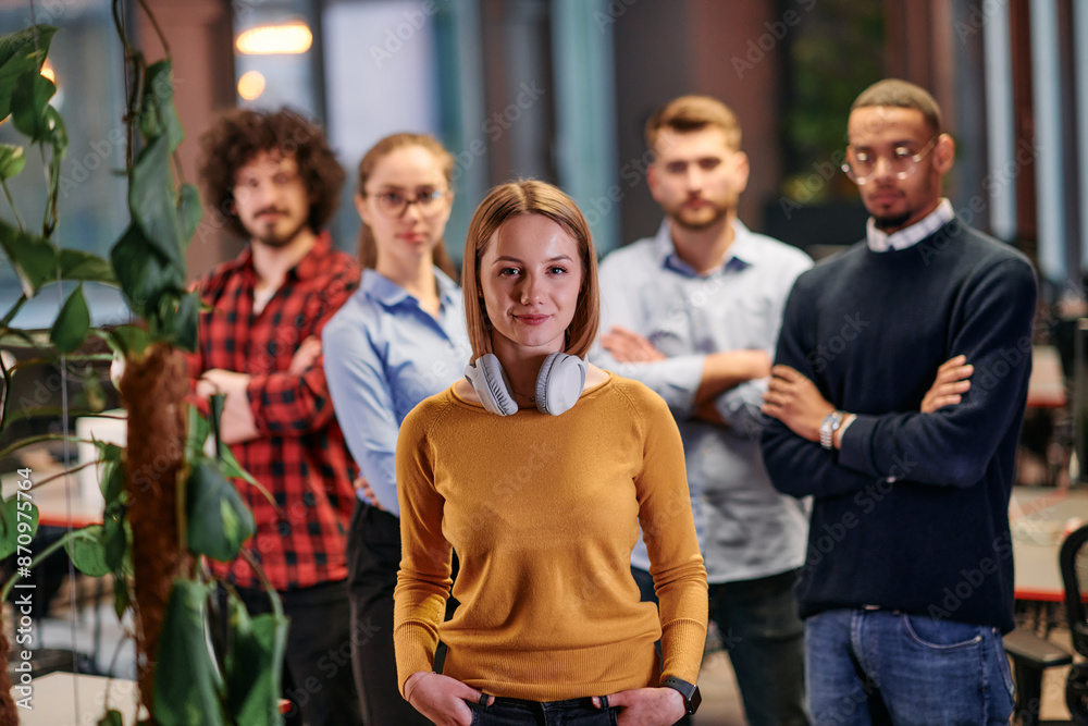 Portrait of successful creative business team looking at camera and smiling. Diverse business people standing together at startup. Selective focus Portrait of successful creative business team looking at camera and smiling. Diverse business people standing together at startup. Selective focus