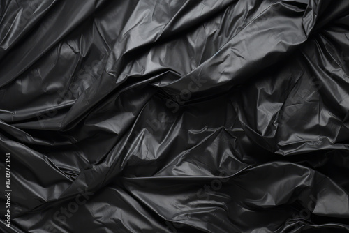 Processed collage of black cellophane garbage bag texture. Background for banner, backdrop © Larysa