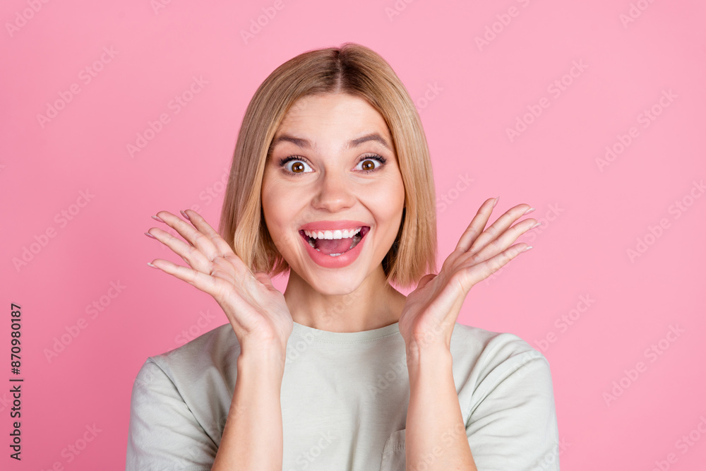 Photo of impressed eccentric woman with bob hairdo dressed gray t-shirt astonished staring raising palms isolated on pink color background Photo of impressed eccentric woman with bob hairdo dressed gray t-shirt astonished staring raising palms isolated on pink color background