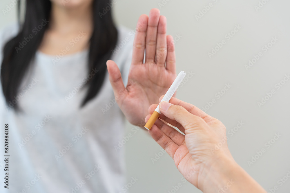 Quit smoking, stop smoke, addiction asian young woman, girl refusing cigarette, smoker quitting smoke, hand in refuse, deny tobacco. Quit bad habit, health care concept. Willpower lifestyle of people. Quit smoking, stop smoke, addiction asian young woman, girl refusing cigarette, smoker quitting smoke, hand in refuse, deny tobacco. Quit bad habit, health care concept. Willpower lifestyle of people.