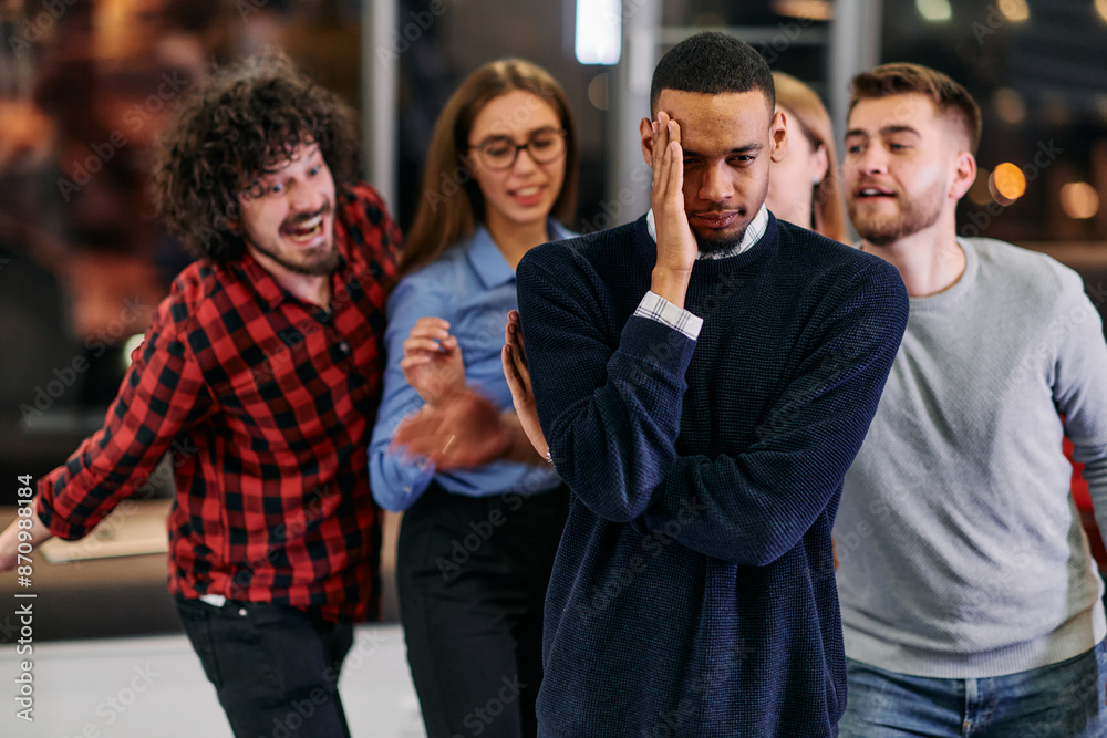 A group of young business people have fun playing interesting games while taking a break from work in a modern office. Selective focus A group of young business people have fun playing interesting games while taking a break from work in a modern office. Selective focus