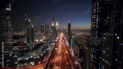 Aerial birds eye view of Dubai city urban futuristic skyline. Panning shot of Dubai