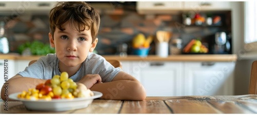 Young Boy Curiously Looking at Allergy-Friendly Foods in a Modern, Bright Kitchen Environment