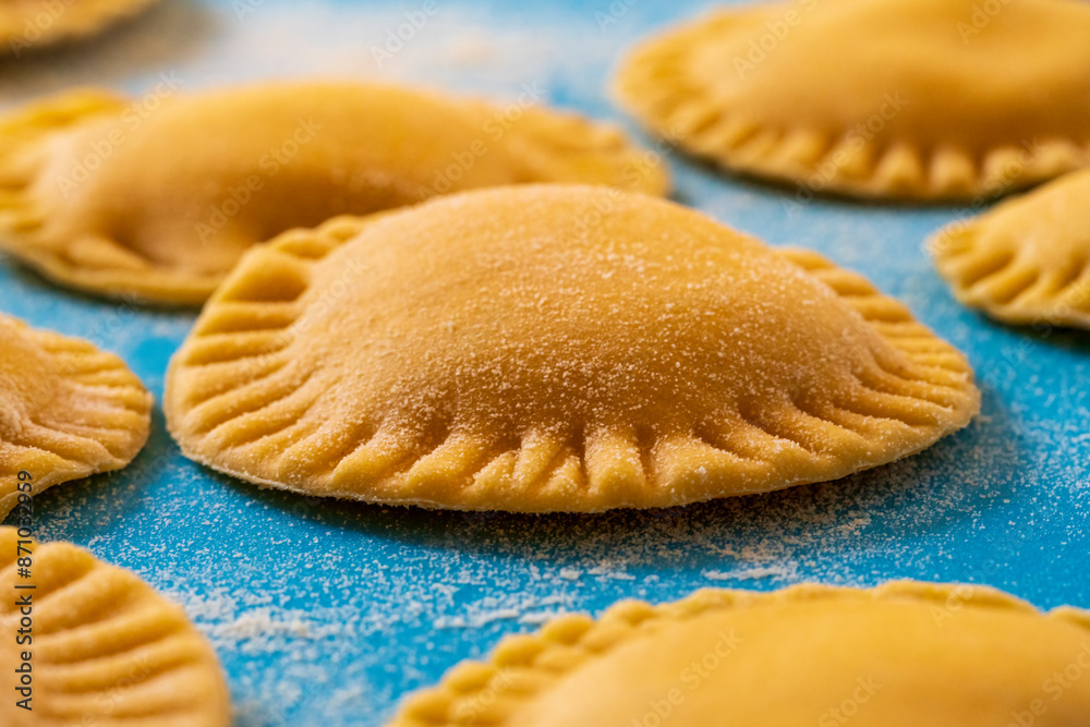Hand made Ravioli noodles in close up view with soft bokeh background Hand made Ravioli noodles in close up view with soft bokeh background