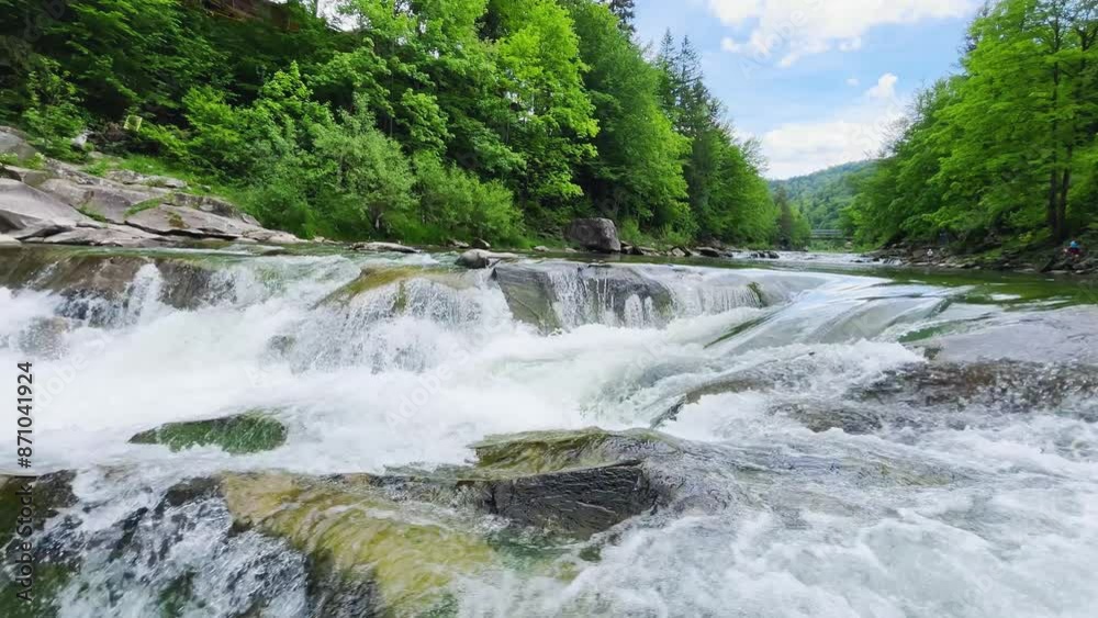 Stormy streams of water and waterfalls of a mountain river. Stormy streams of water and waterfalls of a mountain river.