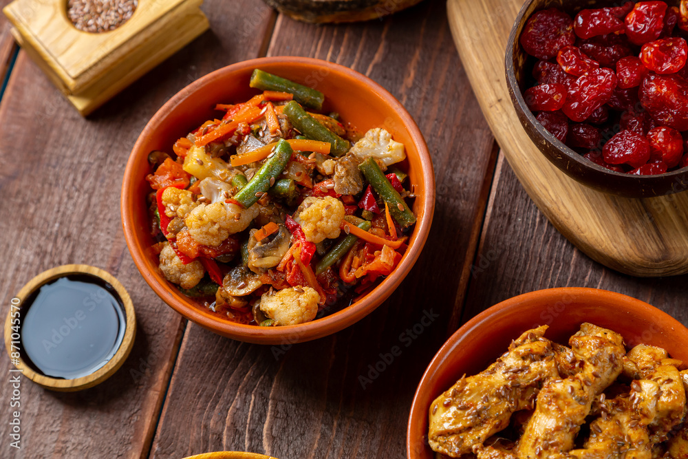 Couscous with chicken and stewed vegetables with meat on the festive table Couscous with chicken and stewed vegetables with meat on the festive table