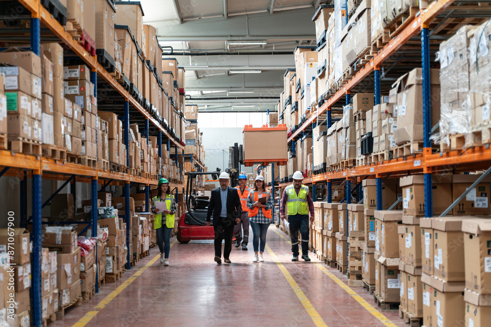 Effective Management in Action: Businessman Engaging and walking with Warehouse Worker and Engineer, Utilizing Digital Tablet Effective Management in Action: Businessman Engaging and walking with Warehouse Worker and Engineer, Utilizing Digital Tablet