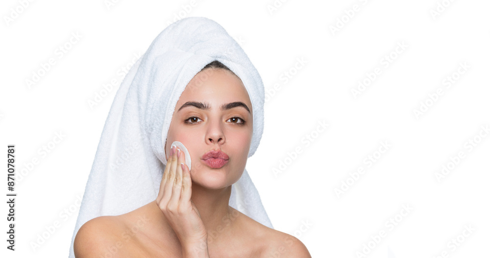 Woman in towel cleaning face skin. Cleansing skin with cotton ball. Skincare cosmetology. Beauty day in spa. Woman use cotton pad. Skincare. Remove the makeup. Beauty routine. Banner Woman in towel cleaning face skin. Cleansing skin with cotton ball. Skincare cosmetology. Beauty day in spa. Woman use cotton pad. Skincare. Remove the makeup. Beauty routine. Banner