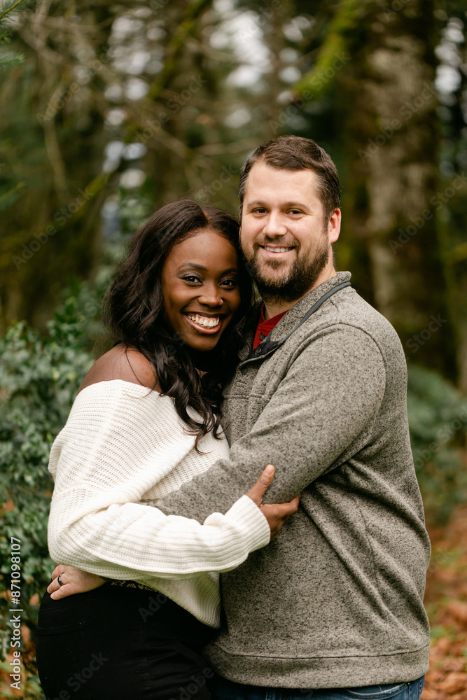 Happy Couple Hug on a Woodsy Path in the Pacific Northwest Happy Couple Hug on a Woodsy Path in the Pacific Northwest