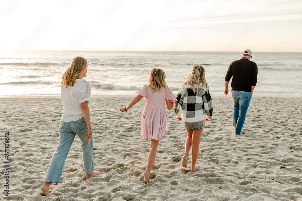 Happy Family with teenagers on the beach together Happy Family with teenagers on the beach together