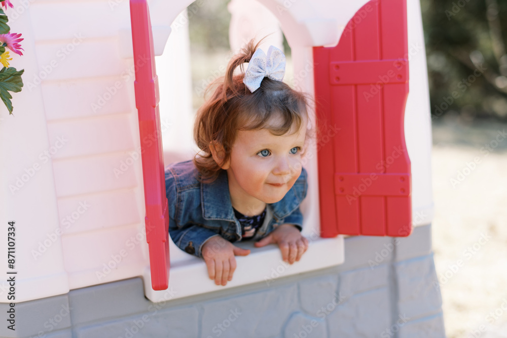 happy smiling toddler playing outdoors in backyard happy smiling toddler playing outdoors in backyard