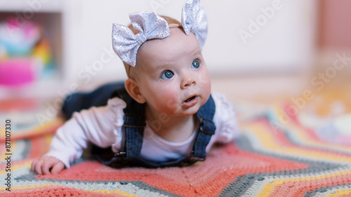 baby on tummy on blanket