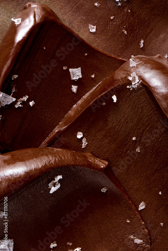 Waves of heavy chocolate ganache sprinkled with coarse salt flakes