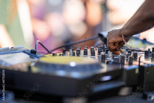 close up to the dj hands with mixing console at the open air african festival in Lisbon