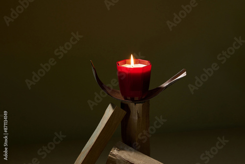 Burning candles and air brick on table