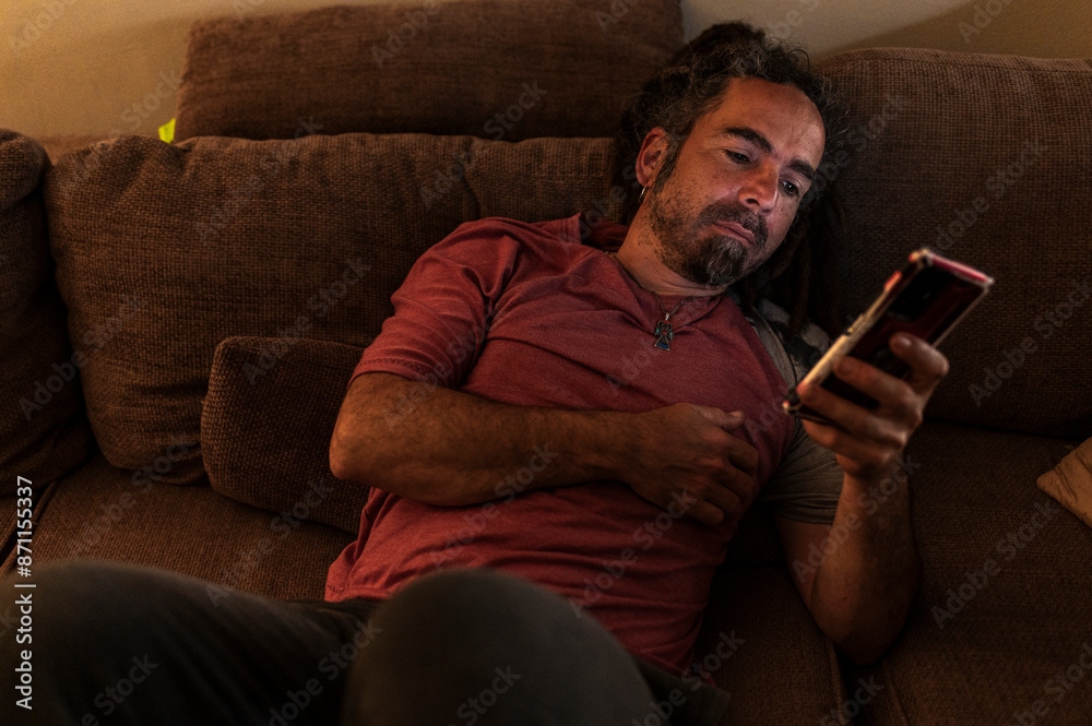 Casual man checking social media with smartphone Casual man checking social media with smartphone