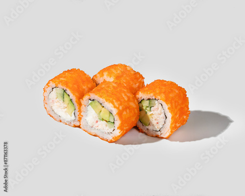 Four pieces of California sushi rolls on a plain background, representing Japanese cuisine perfect for food enthusiasts and culinary blogs