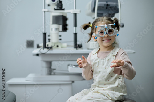 Little girl checking up her sight at ophthalmology center