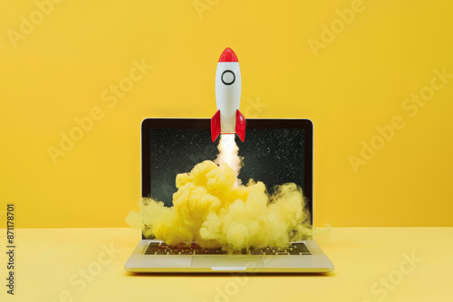 Rocket coming  out of laptop screen, yellow background. Innovation and startup concept.  photo