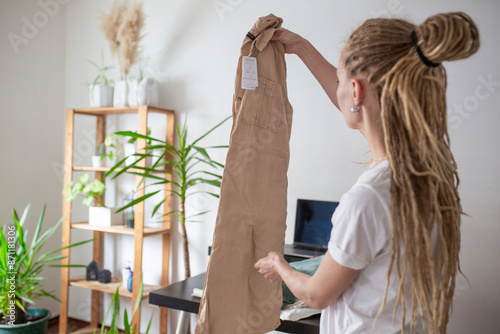 woman recieve delivery package from clothes online shop 